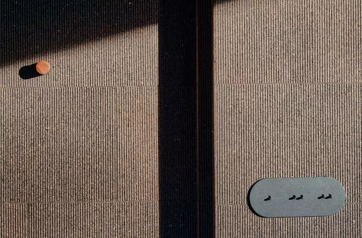 on the walls are panels made of natural cork of different shades and textures (called 3D Tatami)