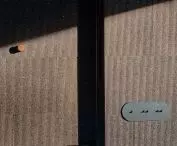 on the walls are panels made of natural cork of different shades and textures (called 3D Tatami)