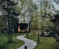the cottage is located adjacent to the forest and cornfields 
