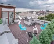Terrace made of composite boards on a structure made of system aluminum joists