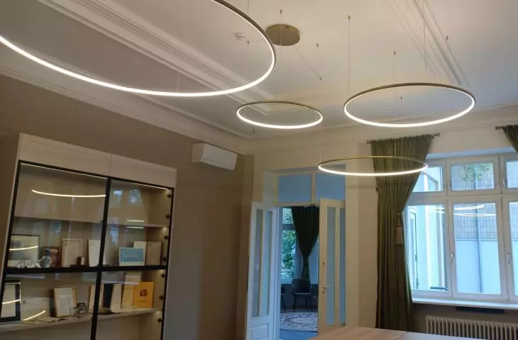 Gold Orbit S LED ring lights in a representative office space