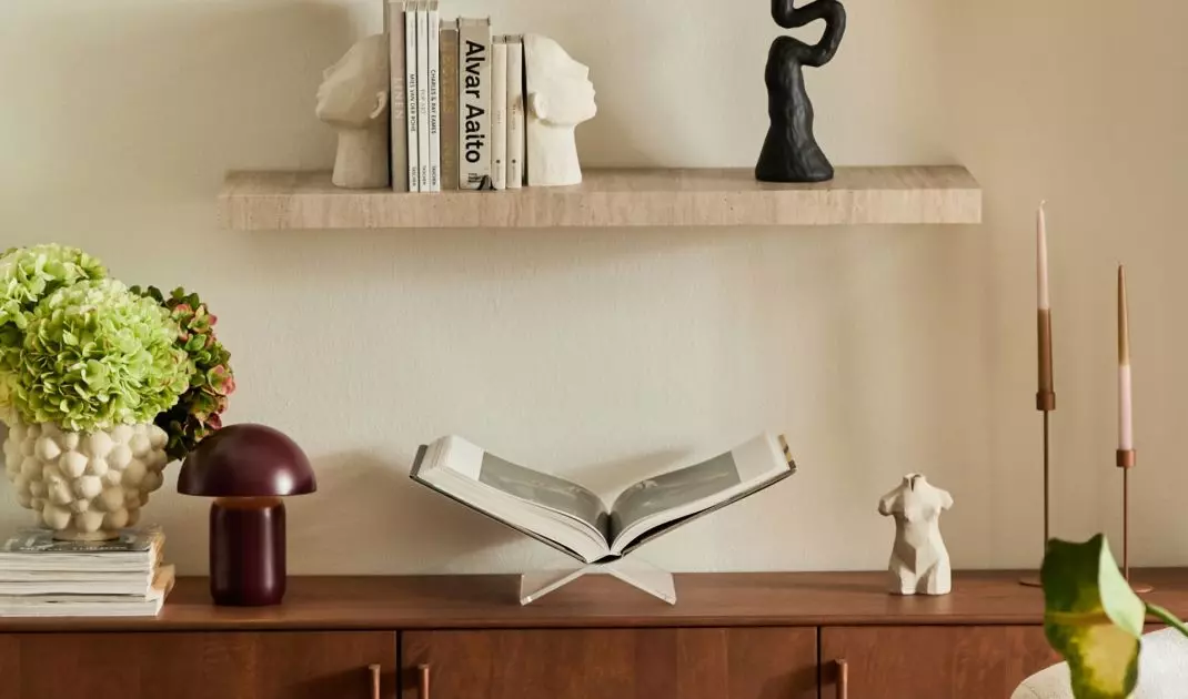 Greenery enlivens and balances the composition, introducing color and natural accent