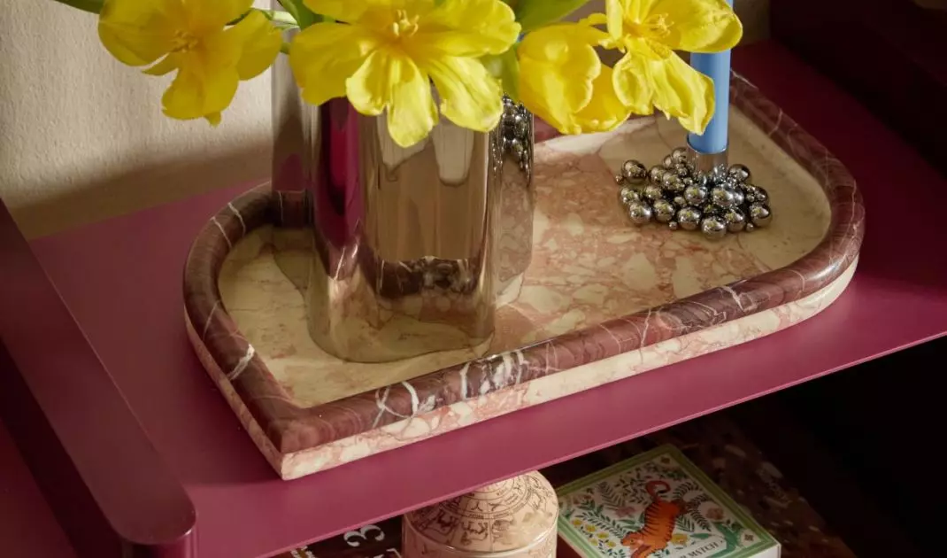 Greenery enlivens and balances the composition, introducing color and natural accent