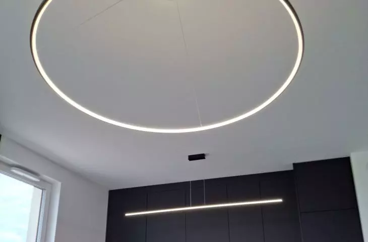  Orbit No.1 large diameter LED lamp - modern kitchen lighting with black cabinetry and dining area, from LEDesign