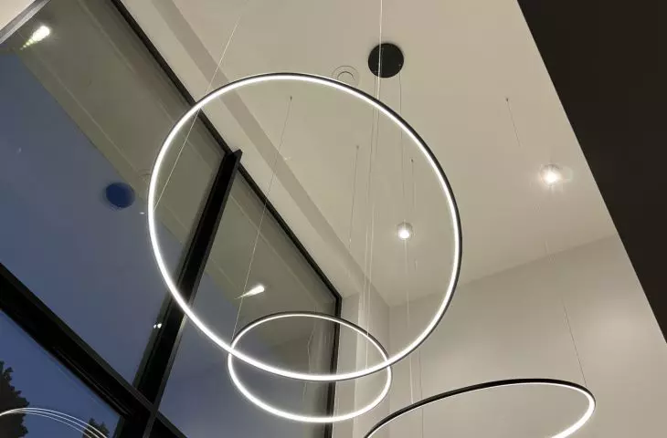 Orbit No.3 LED lamp with three luminous rims - elegant lighting for living room with high ceiling and glass, from LEDesign