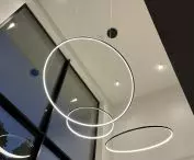 Orbit No.3 LED lamp with three luminous rims - elegant lighting for living room with high ceiling and glass, from LEDesign
