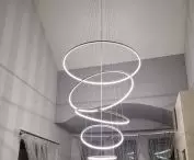 Orbit No.5 LED lamp with five rims - striking high ceiling dining room lighting, from LEDesign.