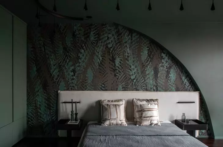The owners' bedroom is dominated by greenery 