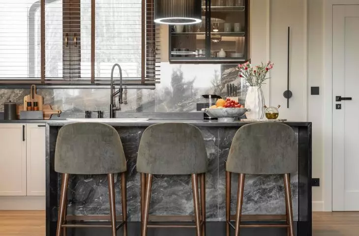 The kitchen is spacious, and the Cosentino natural granite island has become a meeting place