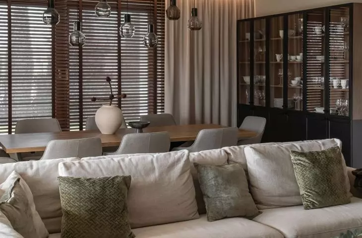 A gray corner sofa and a black coffee table were placed in the living room