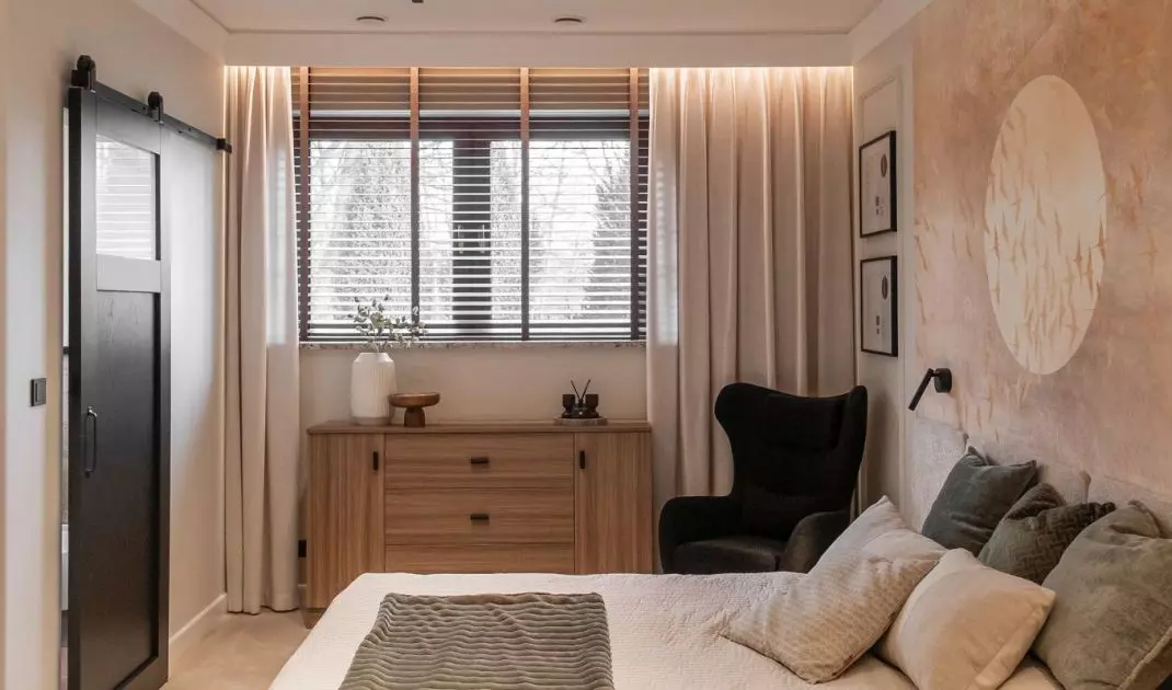 The bedroom is dominated by beige 