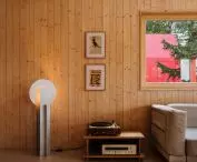 view of the rest area, behind the window the red lump of the sauna is visible