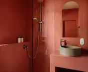The bathroom is kept in a uniform terracotta color