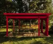 The modern pergola also comes in a strawberry red shade