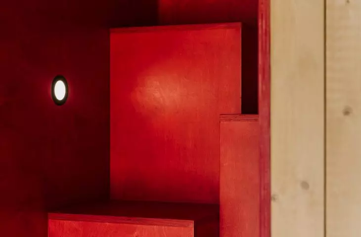 red modules of steps leading to the mezzanine floor