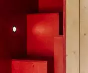 red modules of steps leading to the mezzanine floor