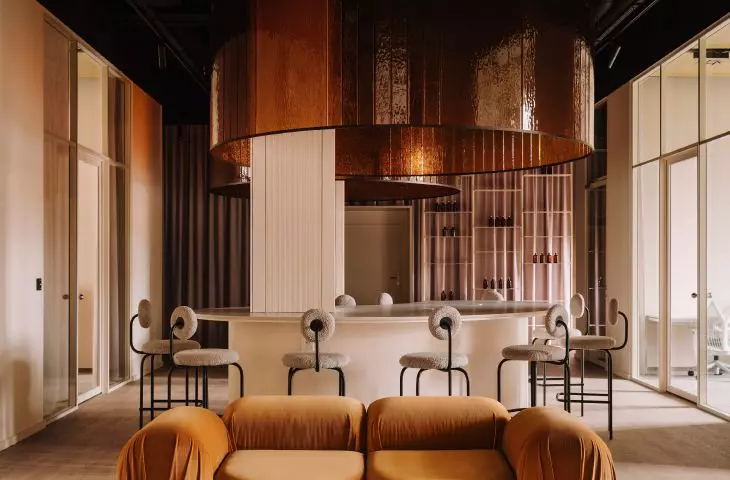 At the entrance to the co-working space, the architects placed a designer sofa