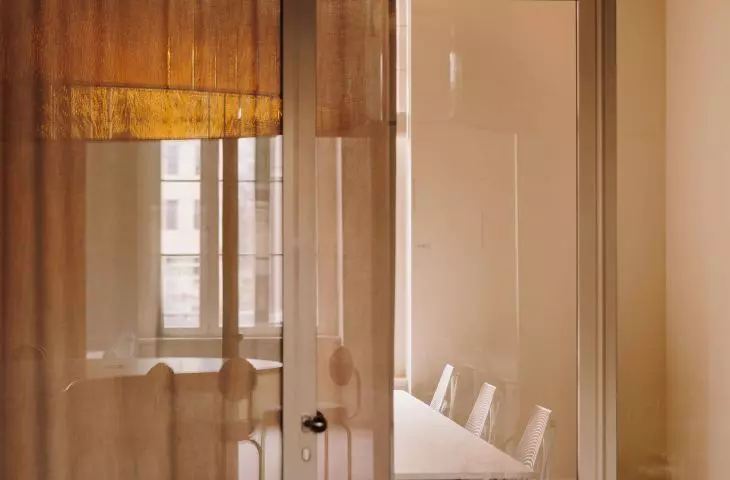 individual offices are separated by high glazing