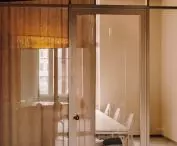 individual offices are separated by high glazing