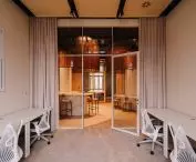 individual offices are separated by high glazing
