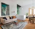 A white island separates the kitchen from the living room