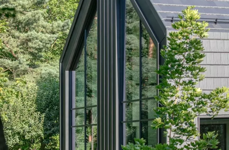 The house on the edge of the forest is an example of architecture that becomes an intermediary between man and nature
