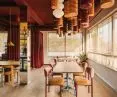 the interior is illuminated by large windows - the architects hung curtains in them to achieve a homey atmosphere