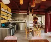 Maroon ceiling and heavy curtain at the entrance add character to the interior