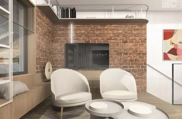 Fragment ściany z surowej cegły w salonie