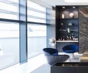 Leather recliners separated by thick curtains provide comfortable rest and privacy, and guests can also enjoy non-alcoholic beverages and chilled champagne 
