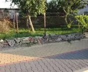 fence mesh with stone foundation