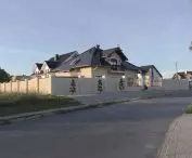 massive fence separating the plot