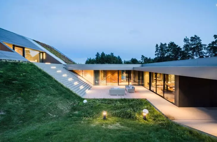 The design uses large glazing