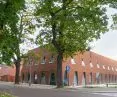 The center - which will house training for doctors - consists of two pavilions of simple shapes with cladding of flat clay tile and brick.  