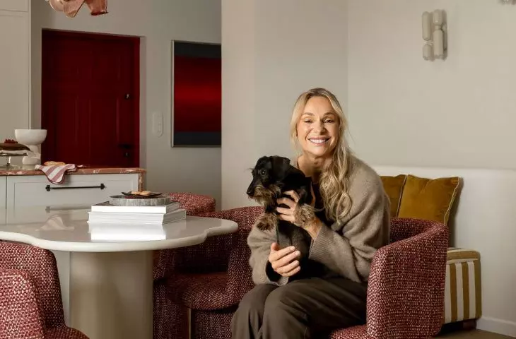 Sonia Bohosiewicz on the background of the lamp designed by Edyta Baranska