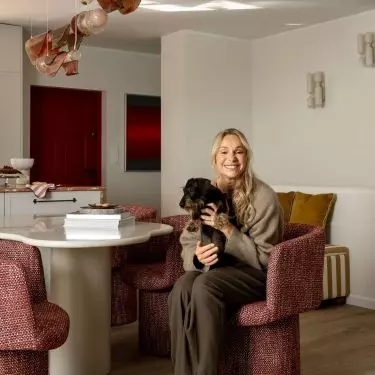 Sonia Bohosiewicz on the background of the lamp designed by Edyta Baranska