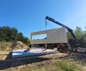 Construction of a FINN house in the village of Ossy