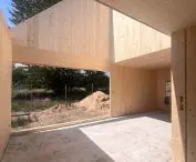 Construction of a FINN house in the village of Ossy