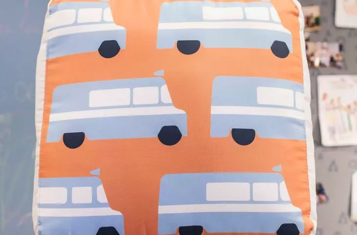 The cushions on one side have illustrations 