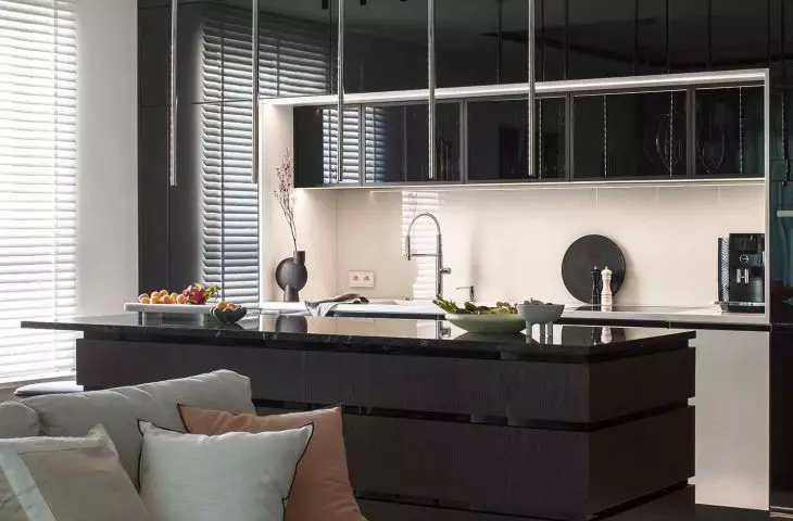 The living room is connected to the dining room and kitchen