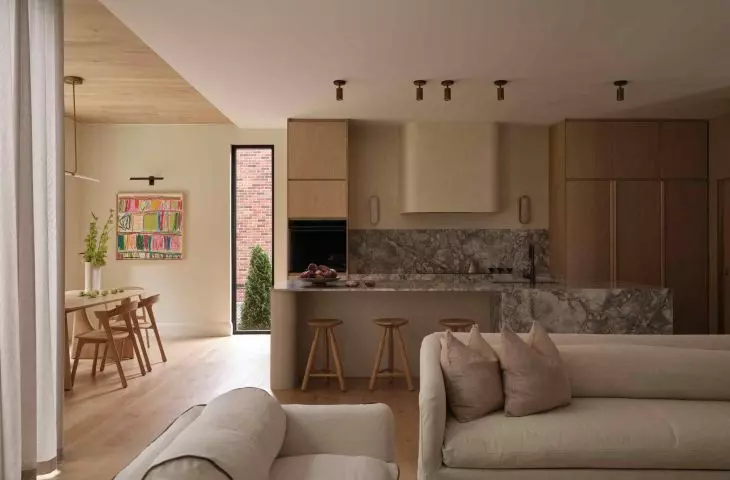 View of the living room connected to the dining room and kitchen