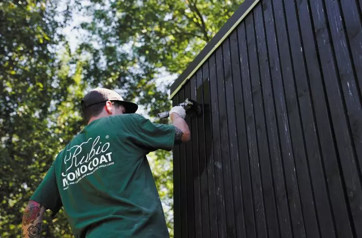 Modern black pine facade finished with DuroGrit in Saddle Black shade