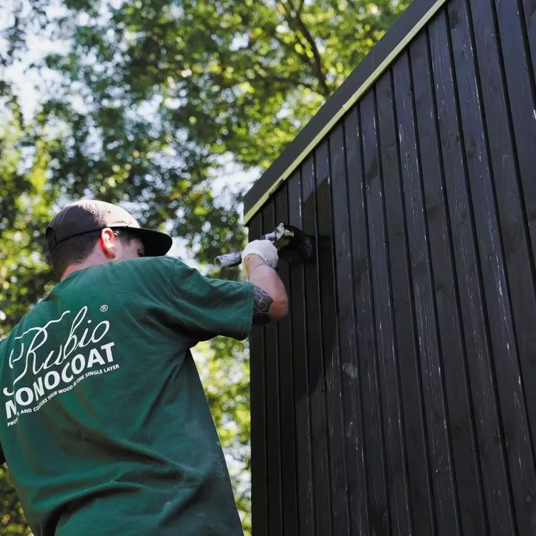 Modern black pine facade finished with DuroGrit in Saddle Black shade