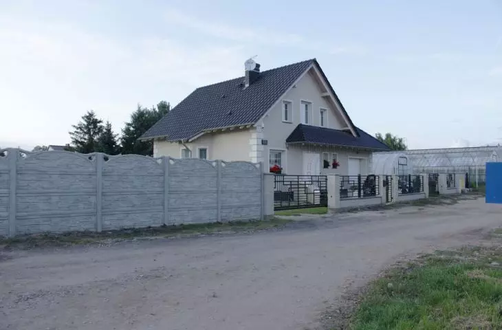 massive fence separating the plot