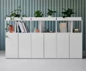 Stepps bookcase supported by base cabinets