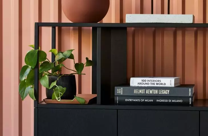 Stepps bookcase supported by base cabinets