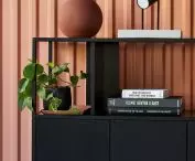 Stepps bookcase supported by base cabinets