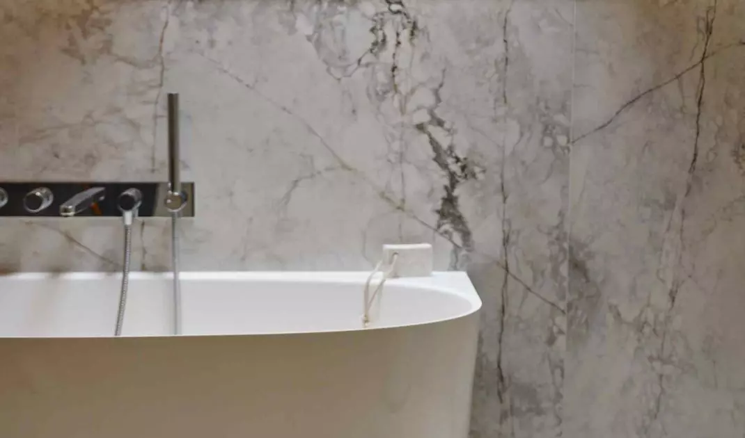 Delicate marble drawing on matte surface adds nobility to the space