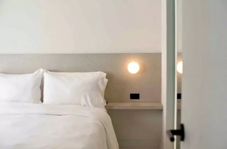 The bedroom retains a more intimate feel