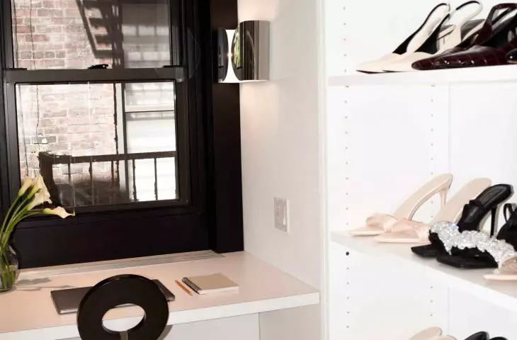 Behind the glass door is a walk-in closet